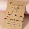 Lichtgevende hartkraal armbanden met verstelbaar zwart koord op een Pinky Promise kaart - Rood Hart