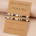 Morse code couple bracelets with heart magnetic charms on gift card display - Heart Style
