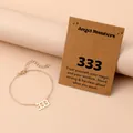Close-up of gold stainless steel angel number 333 pendant with lobster clasp chain - Number 333 / Gold