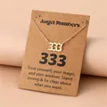 Detail view of gold Angel Number 333 pendant on minimalist stainless steel chain - 333