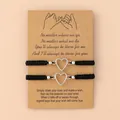 Close-up of two black braided wish bracelets with silver heart charms on kraft paper - Pinky Promise Heart Black Rope (Heart-Black Rope)