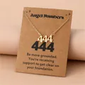 Detail of gold angel number 444 necklace with kraft card display and meaning message - 444
