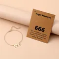 Close-up of gold angel number 666 pendant bracelet on a message card display - Number 666 / Gold