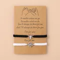 Spin en web roestvrijstalen armbanden op een minimalistische geschenkkaart - Zwart Wit