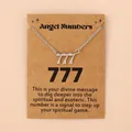 Zilveren engel nummer 777 hanger ketting op bruine displaykaart met tekst - 777