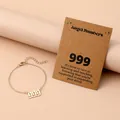 Detail of gold chain bracelet with 999 angel number pendant and message gift card - Number 999 / Gold