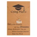 Macro detail of golden graduation pendant with white crystals on a kraft paper card - Graduate Character