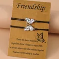 Pink and white butterfly charms on black woven friendship bracelets with card - White and Pink Enamel Style (Style 3-2)