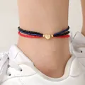 Multilayer colorful seed bead anklet featuring a golden heart charm in red black and blue - Anklet / Black/Blue/Red
