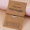 Bracelet de vœux fait main en cordon noir avec pendentif renard argenté sur carte cadeau - Renard
