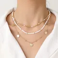 Three-layer bohemian necklace featuring pearls, white seed beads and gold shell pendants - 3-Layer Necklace Set / Gold