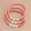 Ensemble de 3 bracelets bohème à perles roses avec cœurs dorés et inscription Luck - Ensemble 3 pièces LUCK