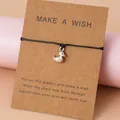 Bracelet de vœux tressé main avec pendentif canard argenté sur carte en kraft - Bracelet Petit Canard