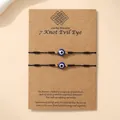Set van twee zwarte gevlochten Evil Eye armbanden met zeven knopen op kraftkaart - Zwart