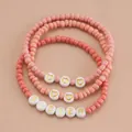 Lot de 3 bracelets en perles roses avec cœurs dorés et breloques lettrées SISTER - Ensemble 3 pièces SISTER