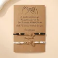 Vriendschapsarmband set met gouden oneindigheidshart op zwart en wit gevlochten touw - Hart Goud Zwart Wit