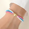 Drielaagse kralenarmband met roze, blauwe, witte kralen en een gouden hart hanger - Armband / Roze/Geel/Blauw