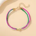 Bracelet bohème à trois rangs avec perles colorées et pendentif en forme de cœur doré - Bracelet triple couche cœur rouge vert