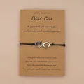 Handmade infinity cat wish bracelet with heart charm on kraft paper display card - Black
