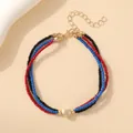 Bracelet bohème à trois rangs de perles rouges, bleues et noires avec un charmant cœur doré - Bracelet triple couche cœur bleu rouge