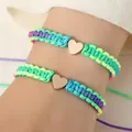 Regenboog geweven armbandenset met gouden hartbedeltjes voor koppels - Set van 2 / Kleurrijk