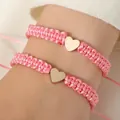 Adjustable pink braided rope bracelets with gold heart charms for couples and women - Set of 2 / Pink