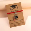 Graduation gift set with red woven bracelet, rhinestone doctoral cap charm, and card - Red