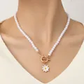 Bohemian pearl bracelet with golden daisy pendant and OT buckle on wrist - Clavicle Necklace White Daisy Pearl Style (Necklace White)