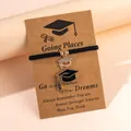 Black woven graduation bracelet set with crystal doctoral cap charms on gift card - Black