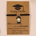 Braided black graduation bracelet with gold-framed graduate charm on a gift card - Blue Collar Student Black Rope (Student-4)