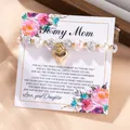 Elastic pearl bracelet with a gold heart charm and crystal beads on a floral gift card - Gold Heart Style (FD2531321)