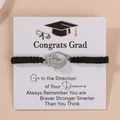 Braided graduation bracelet with silver mortarboard charm on congratulatory display card - Black