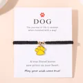 Bracelet cordon noir fait main avec pendentif patte jaune sur carte de présentation - Jaune