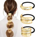 Detail of gold textured metal hair ties with lava ripples on high elastic rubber bands - Gold Lava Wave Style Combo