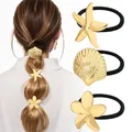 Detail of golden starfish shell and flower charms on elastic hair ties for women - Gold Ocean Floral Combo Style