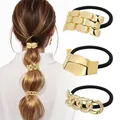 Detailed view of elastic hair ties featuring geometric gold accents and high gloss finish - Gold Minimalist Geometric Strip Combo