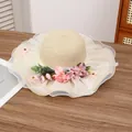 Beige woven straw sun hat with white lace trim and pink floral accents for women - Artificial Flower Beige Pink