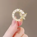 Elegant gold butterfly brooch featuring lustrous white pearls and sparkling crystals - Round Pearl Gold