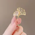 Elegant golden ginkgo leaf brooch with sparkling zircons and delicate filigree design - Diamond Ginkgo Leaf