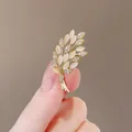 Elegant gold brooch with opal leaves and pave zircons in a delicate wheat ear shape - Wheat Ear