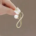 Elegant tulip brooch with gold metal, white mother-of-pearl petals and a large pearl - Tulips 2