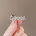 Elegant golden Queen letter brooch with crown detail and sparkling rhinestones for women - Queen 2