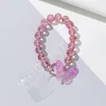 Telefoon polsbandje met roze facetgeslepen kralen en transparante vlinder hanger met metalen - Rozerood
