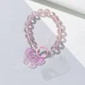 Detail of pink beaded phone charm strap with large purple butterfly pendant and clear clip - Pink