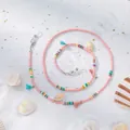 Detail of pink beaded eyewear chain with colorful tassels and natural sea shells - Pink Base Bead Style A / Pink