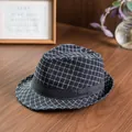 British style black plaid wool fedora hat with elegant ribbon on a wooden table - 58cm / Black Grid