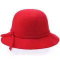 Elegant red wool cloche hat for women with minimalist bow detail on white background - Red
