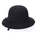 Elegant black wool cloche hat for women with a delicate wave brim and ribbon accent - Black