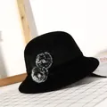 Women's black wool felt bucket hat featuring stylish faux fur pom-poms and rhinestones - M (56-58cm) / Black