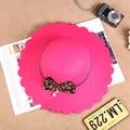 Hot pink wool felt hat featuring a leopard print bow and elegant wavy brim details - M (56-58cm) / Rose Red